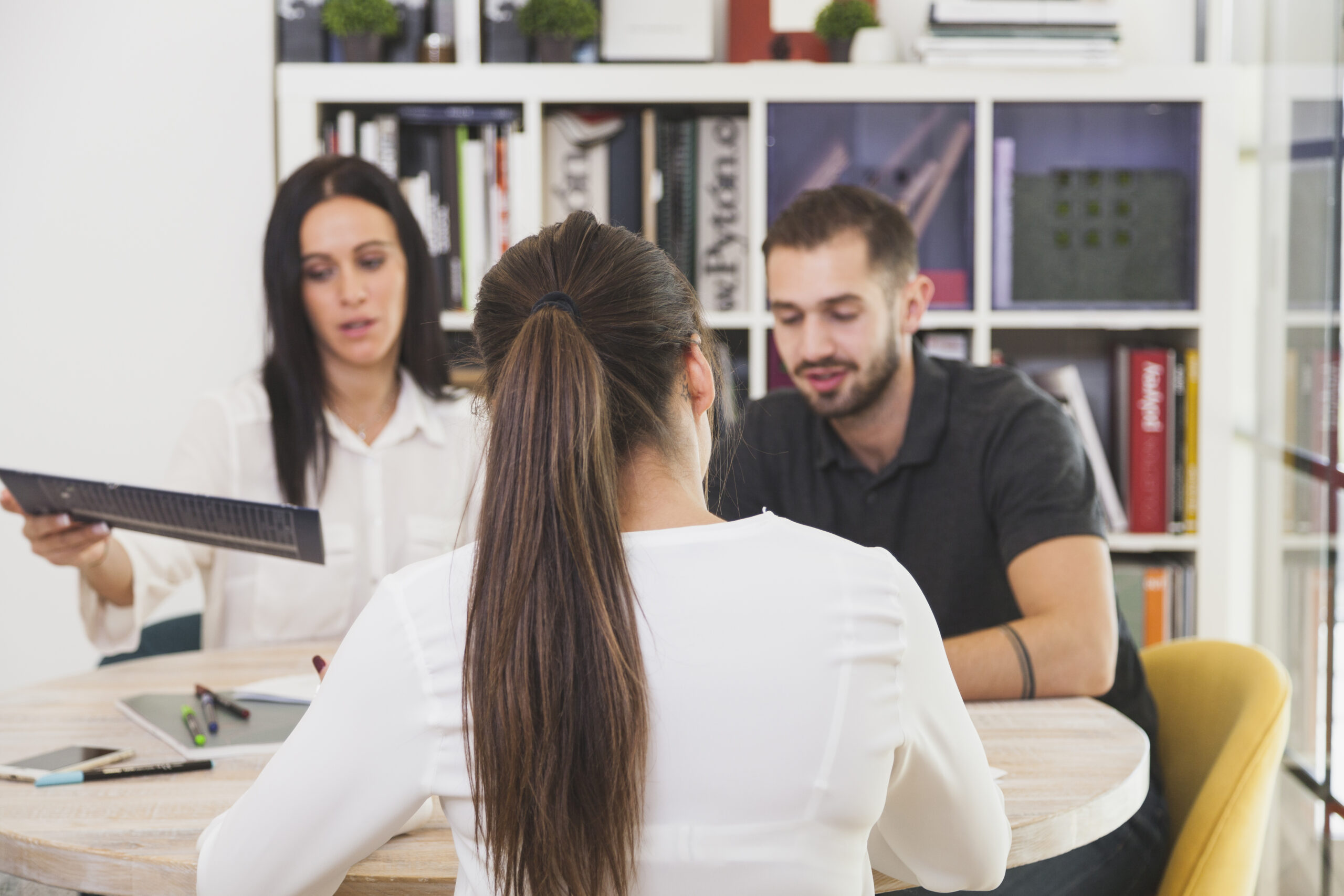 Woman sitting in office and talking