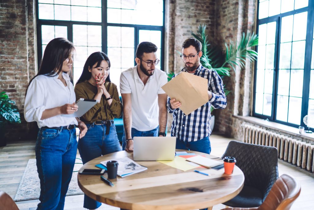 Employees Discussing How to Convince Leadership It’s Time for Better HR Compliance Training